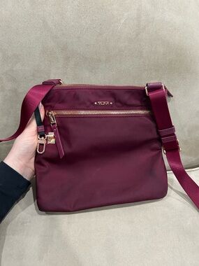 Tumi Burgundy Crossbody Bag with Gold Hardware